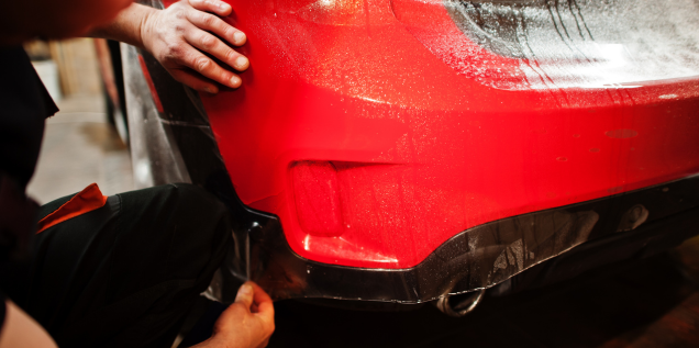 A car undergoing bumer repair in Surrey.